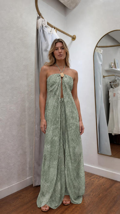 Model wearing sage green patterned halter maxi dress