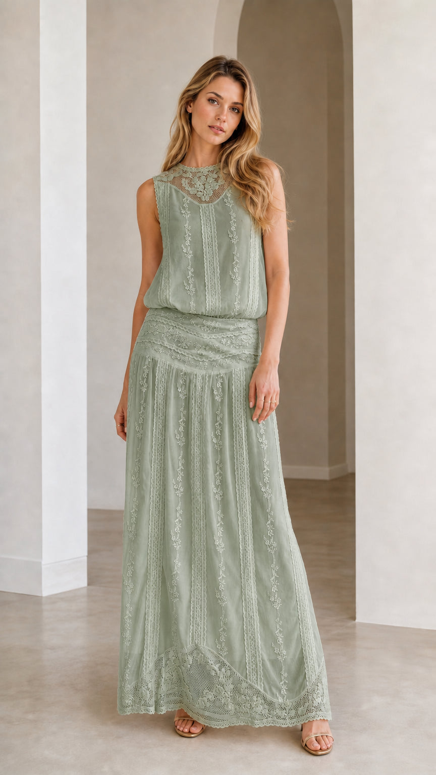 Woman wearing sage green embroidered maxi dress