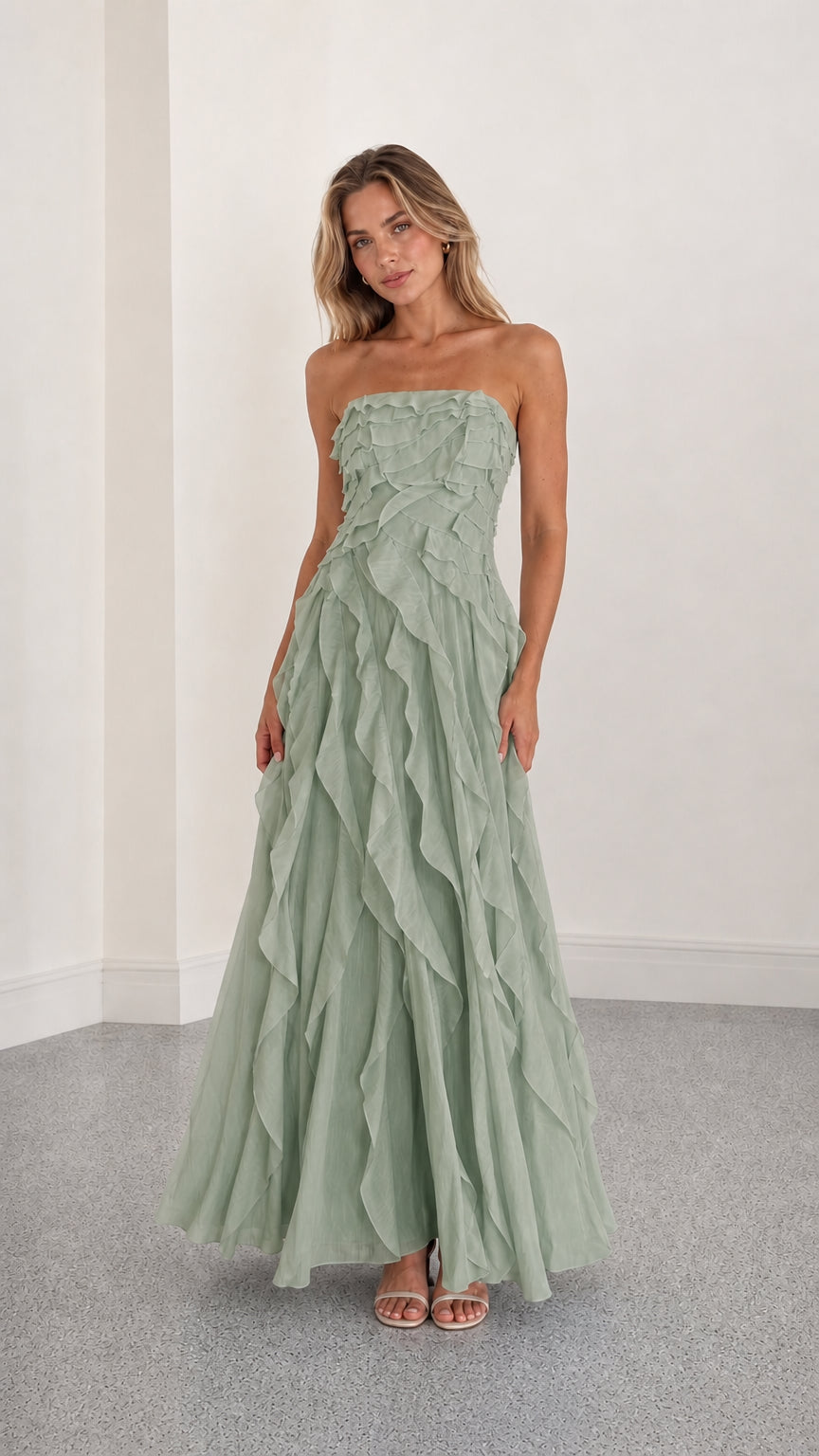 Full length view of sage green strapless ruffle maxi dress