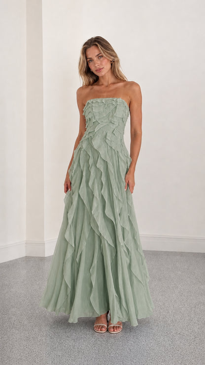 Full length view of sage green strapless ruffle maxi dress