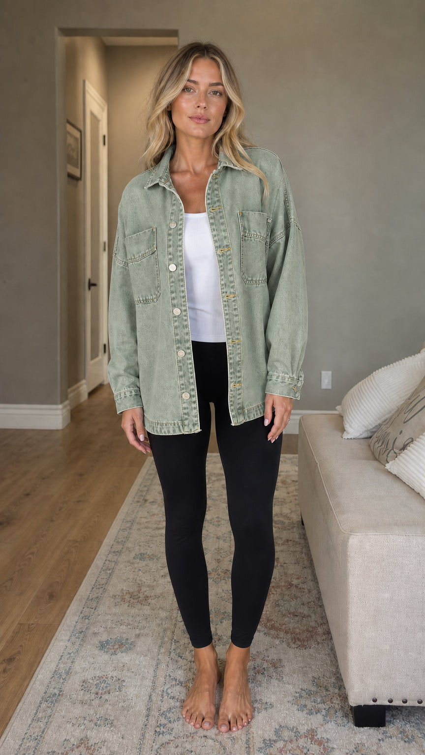 Front view of woman wearing sage green denim shacket