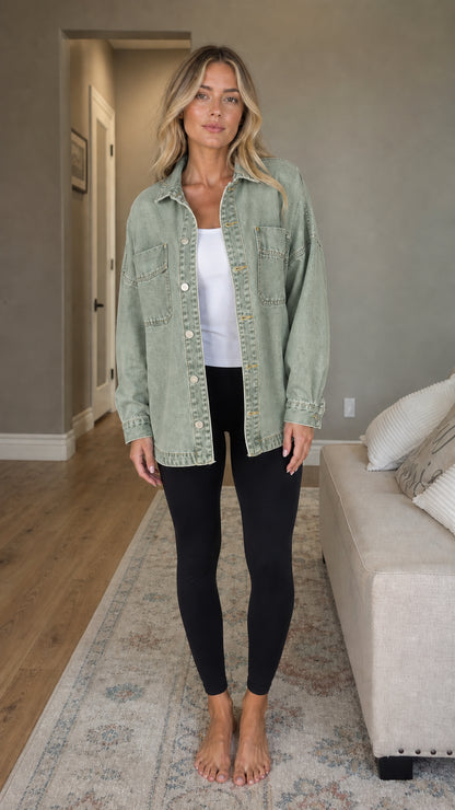 Front view of woman wearing sage green denim shacket