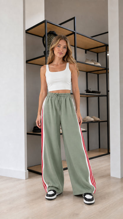 Front view of model wearing Sage Green wide leg striped sweatpants