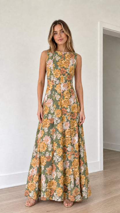 Woman wearing green floral print maxi dress