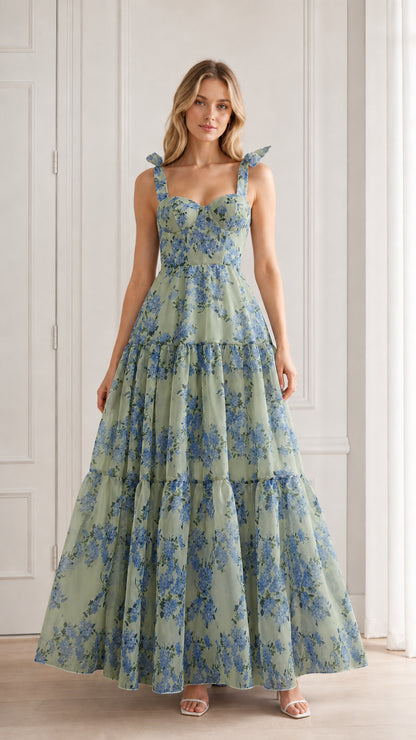 Model wearing green floral tiered maxi dress