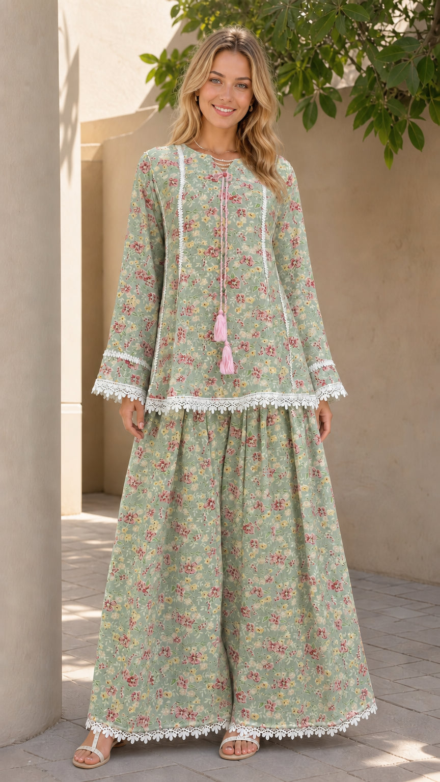 Model wearing sage green floral matching tunic and pants set