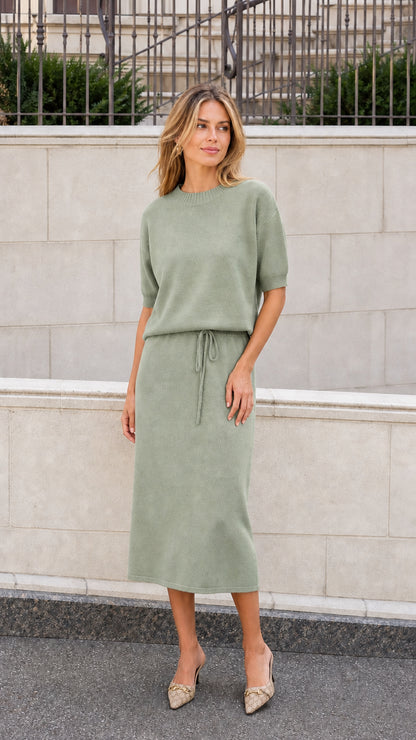 Sage green short sleeve knit midi dress with drawstring waist shown on a model