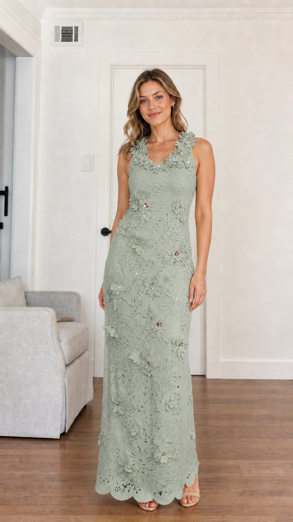 Woman wearing sage green floral applique sleeveless maxi dress
