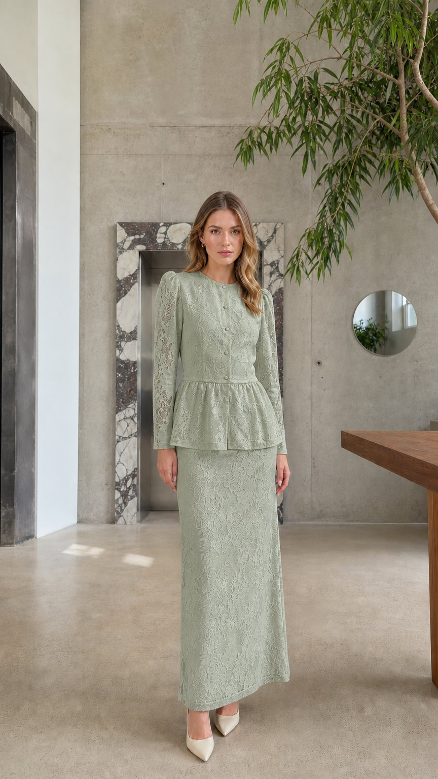 Full length view of model wearing the Sage Green floral lace peplum top and maxi skirt set