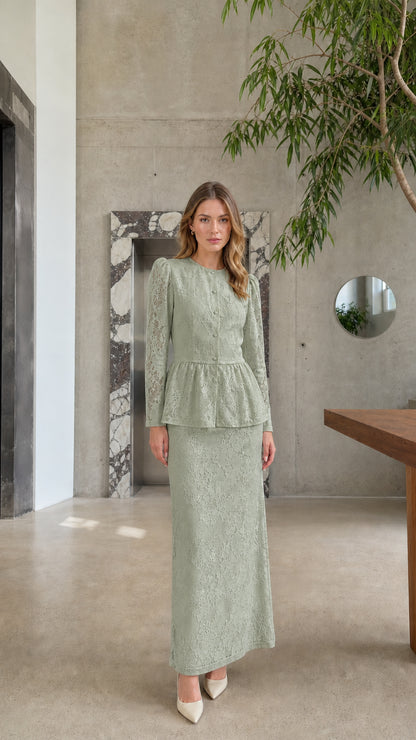 Full length view of model wearing the Sage Green floral lace peplum top and maxi skirt set