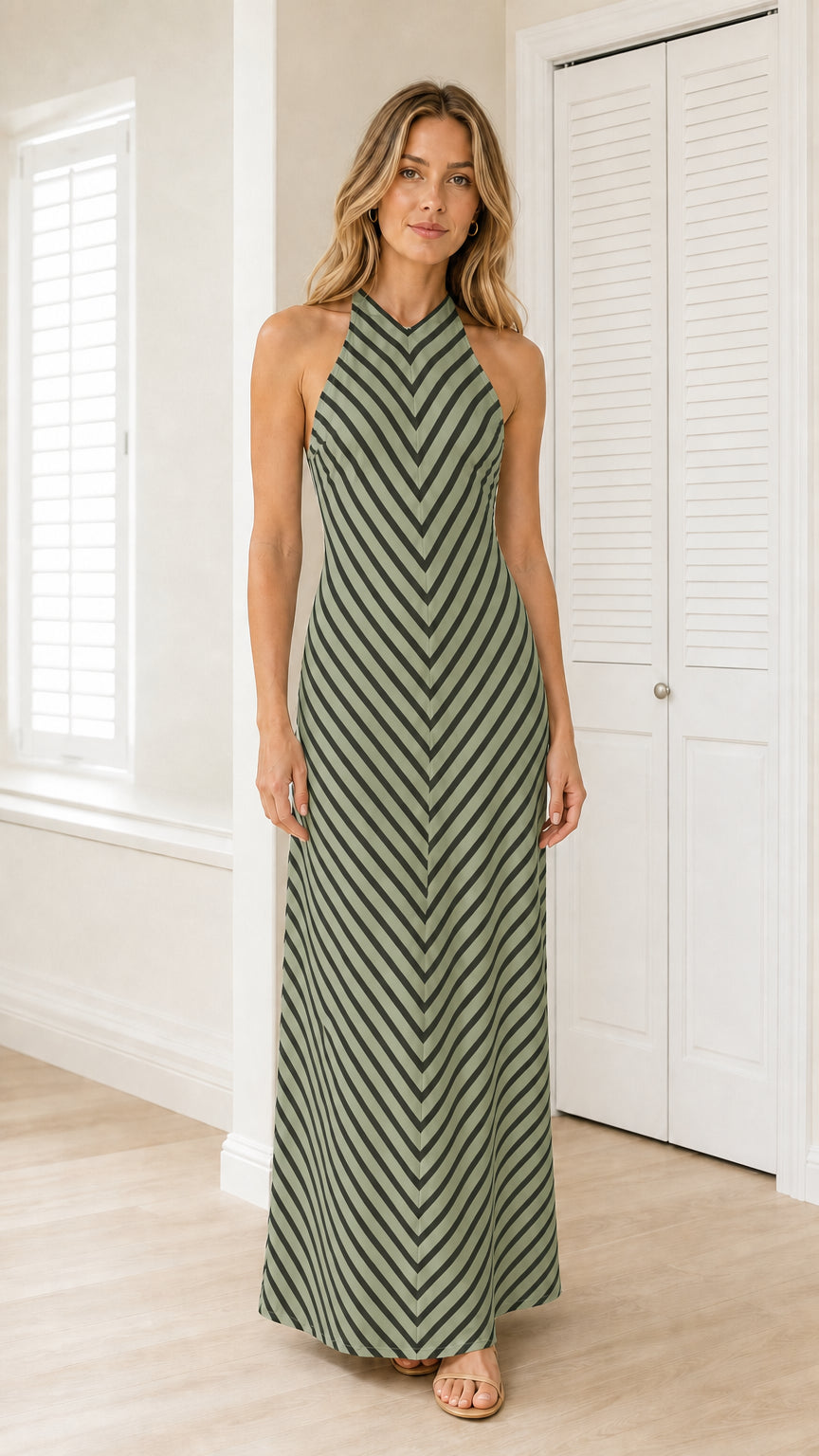 Front view of model wearing olive green striped halter maxi dress