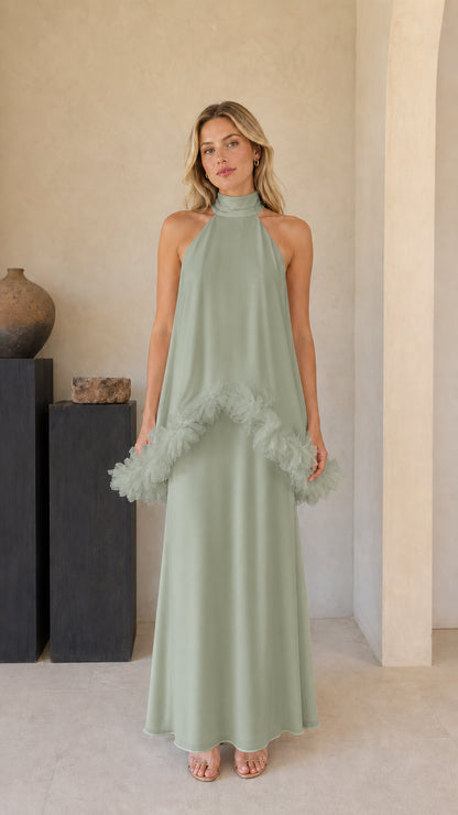 Model wearing sage green sleeveless high-neck formal maxi dress