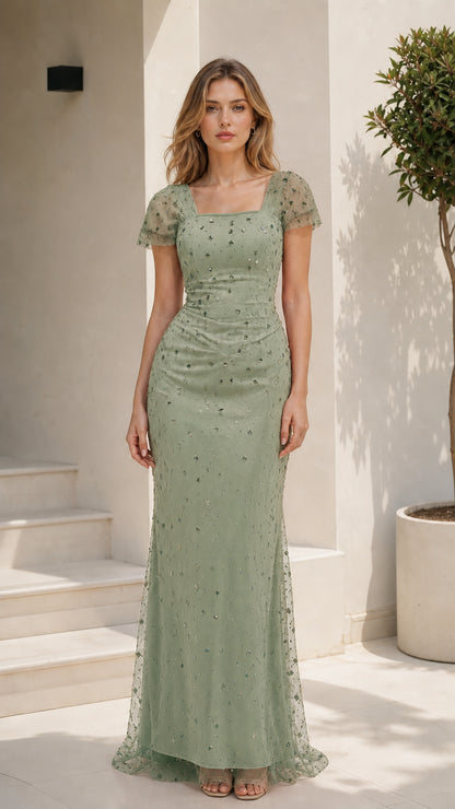 Front view of model wearing a sage green embellished flutter sleeve gown
