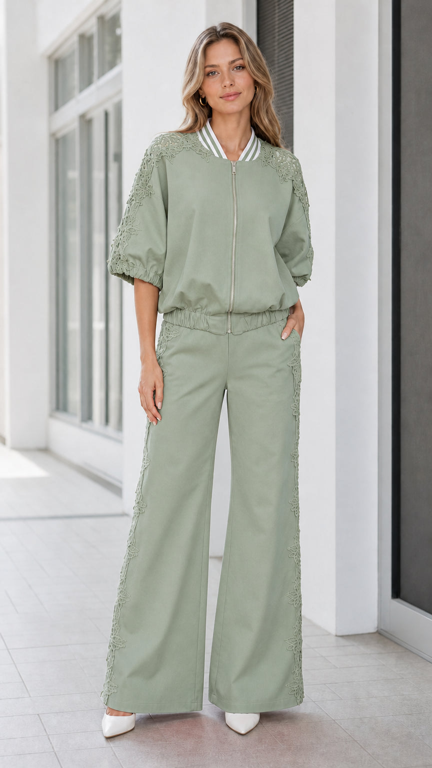 Front view of women's sage green lace trim zip jacket and wide-leg trousers set