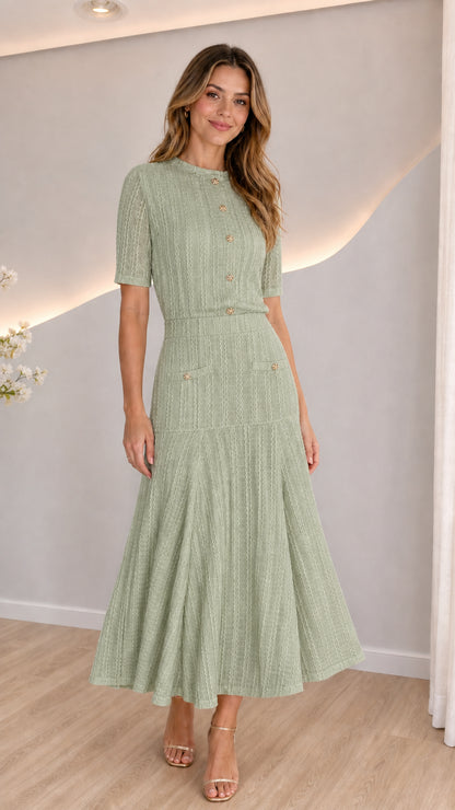 Model wearing sage green short sleeve knit top and flared skirt two-piece set