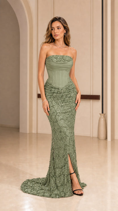 Front view of model wearing sage green strapless corset evening dress