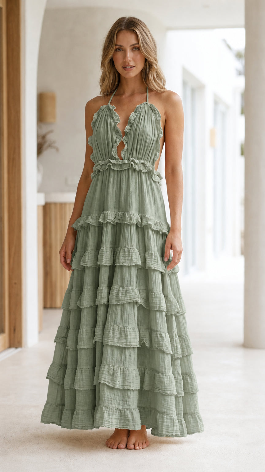 Model wearing Sage Boho Ruffle Halter Backless Tiered Maxi Dress