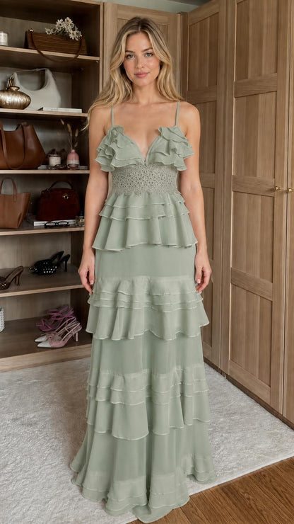 Front view of model wearing sage green ruffled tiered maxi dress