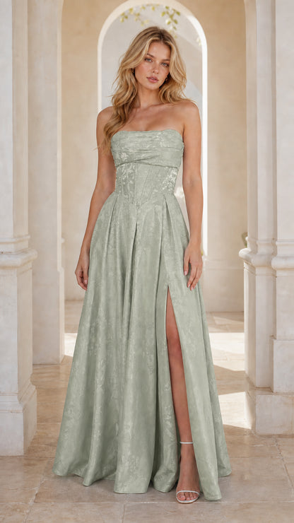Model wearing sage green strapless jacquard maxi gown