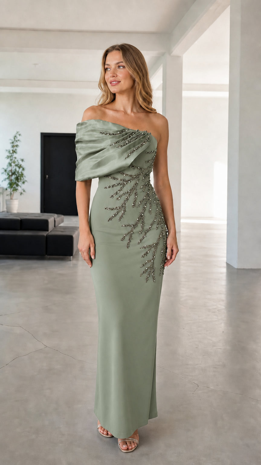 Full-length view of sage green asymmetric draped beaded evening maxi gown