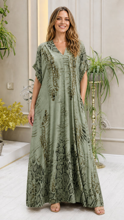 Model wearing sage green animal print kaftan dress