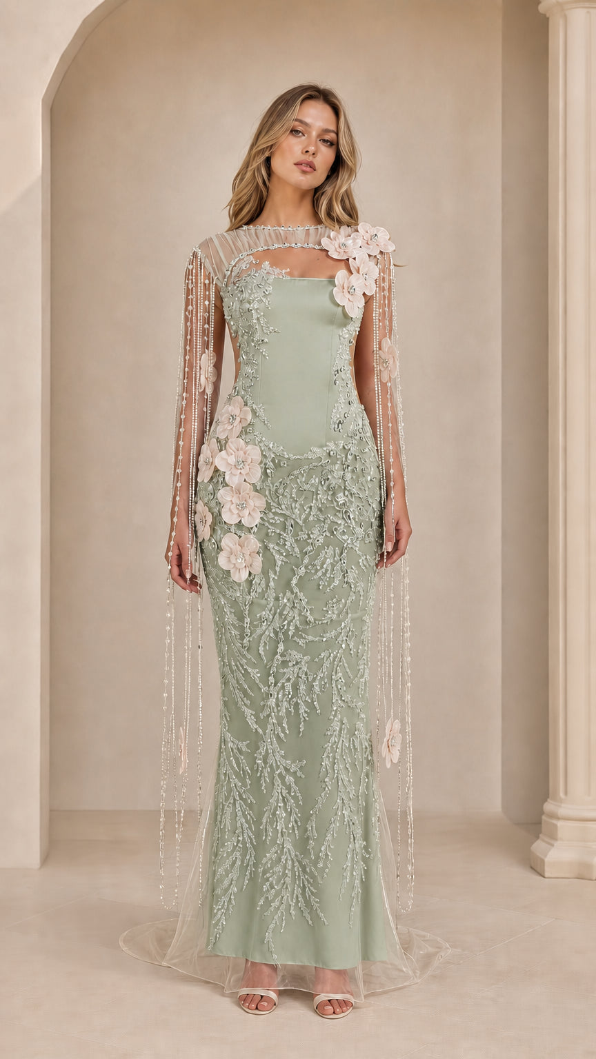 Sage green embroidered evening gown with sheer cape sleeves