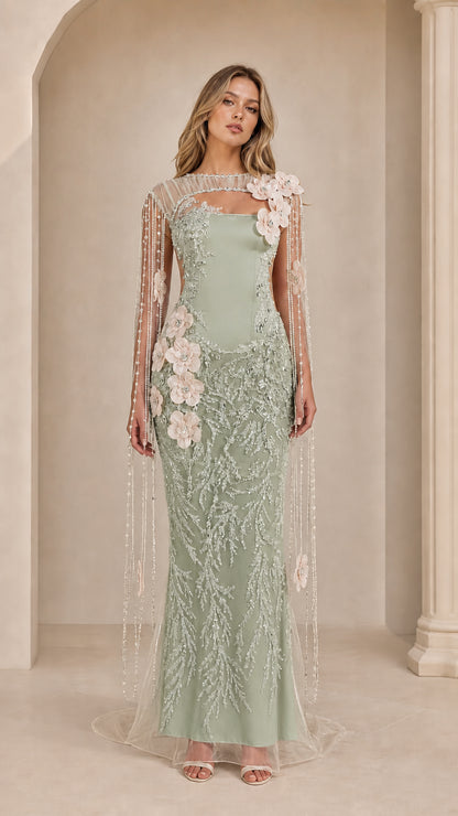 Sage green embroidered evening gown with sheer cape sleeves