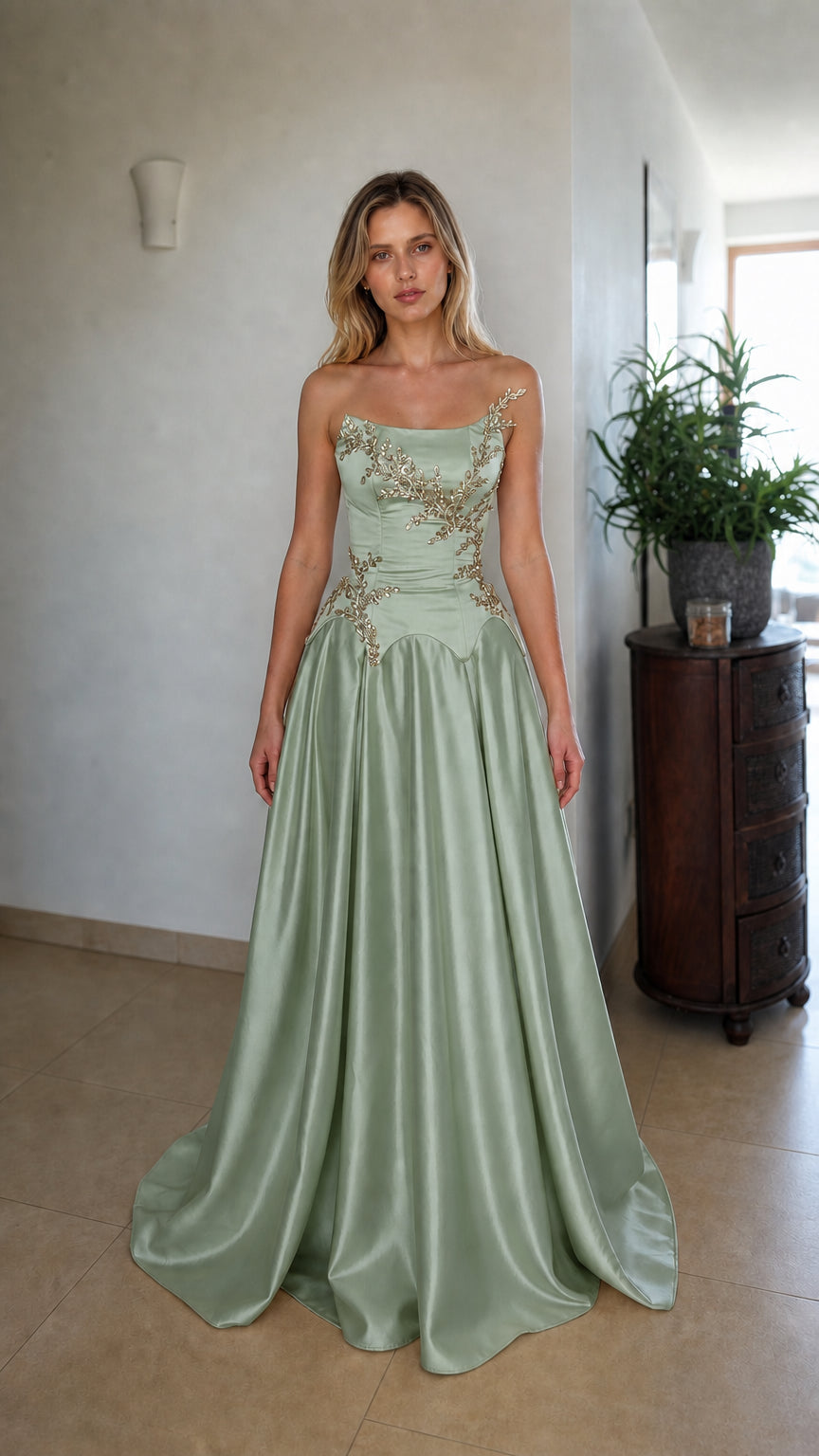 Front view of sage green strapless beaded corset evening dress