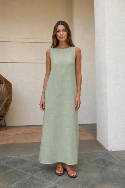Woman wearing sage green sleeveless maxi dress