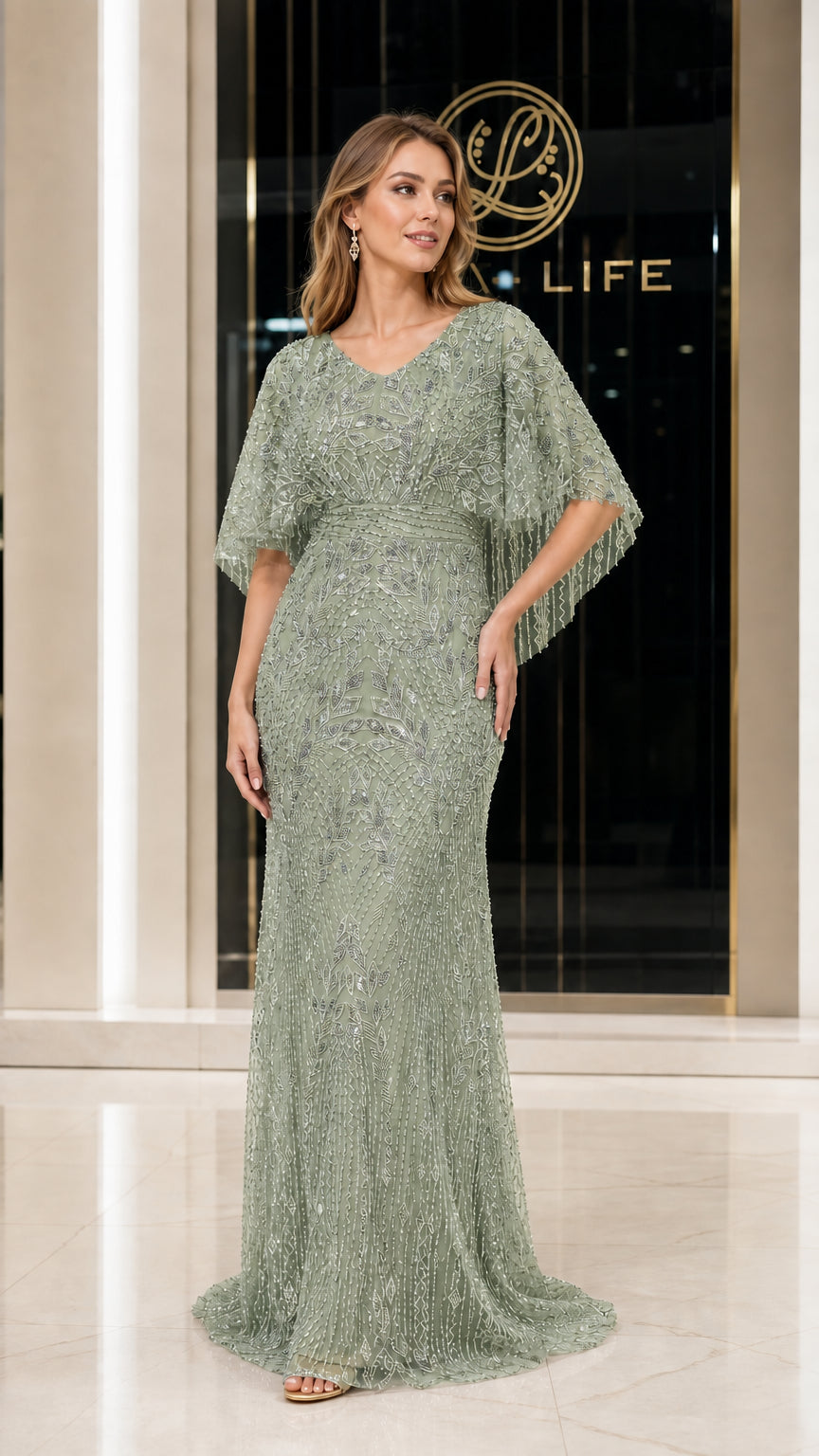 Front view of woman wearing sage green beaded evening gown