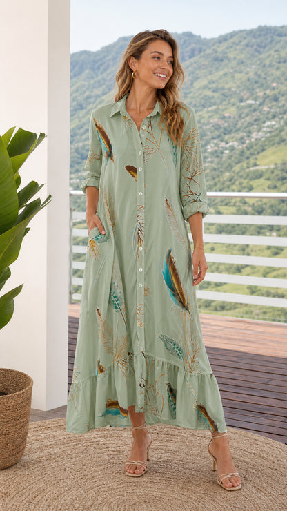 Front view of model wearing sage green feather print maxi shirt dress