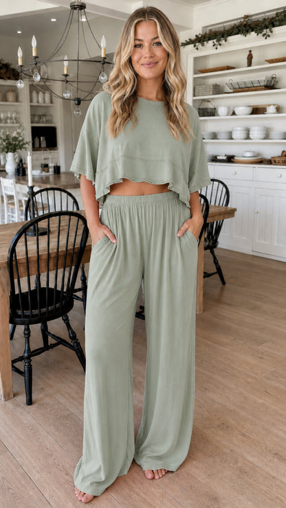 Front view of woman wearing sage green two piece cropped top and wide leg pant set