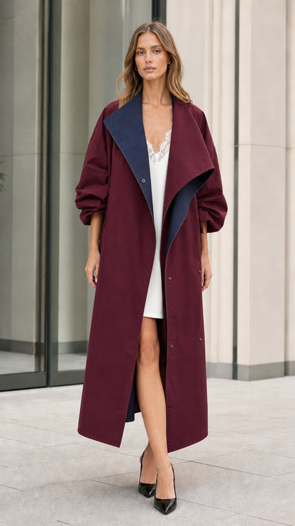 Model in burgundy wine-colored maxi duster coat with contrasting lapel