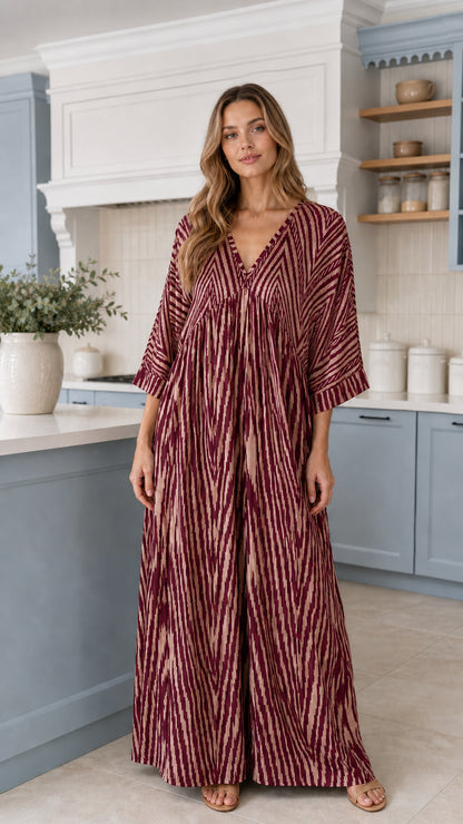Front view of woman wearing Burgundy wine printed wide-leg maxi jumpsuit
