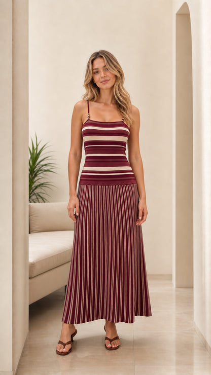 Woman wearing burgundy and cream striped knit sleeveless maxi dress