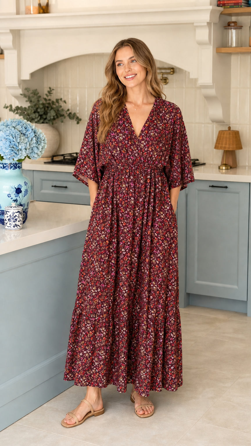 Full front view of model wearing burgundy floral maxi dress