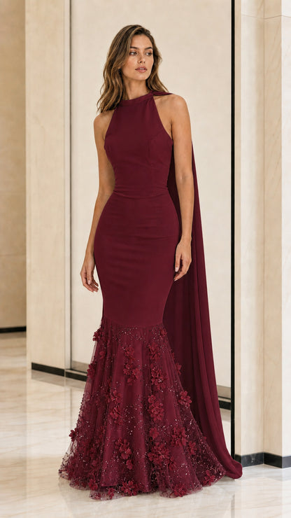 Front view of burgundy halter mermaid evening dress with cape