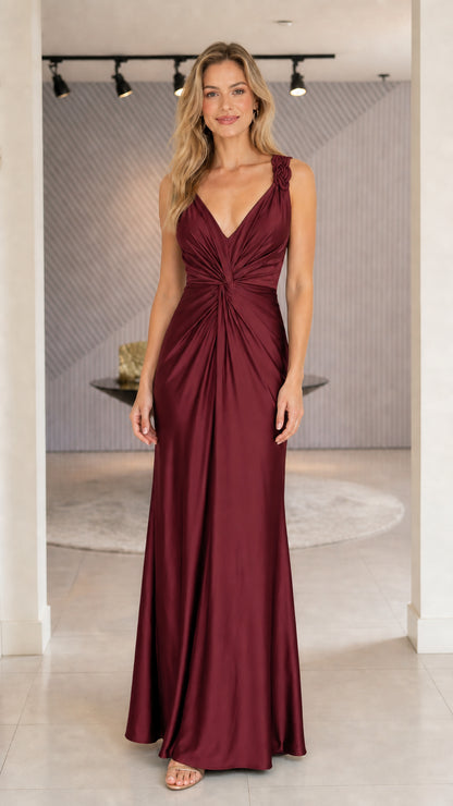 Model wearing burgundy satin evening dress