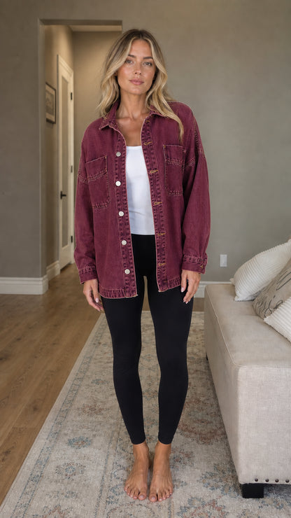 Front view of woman wearing burgundy denim shacket