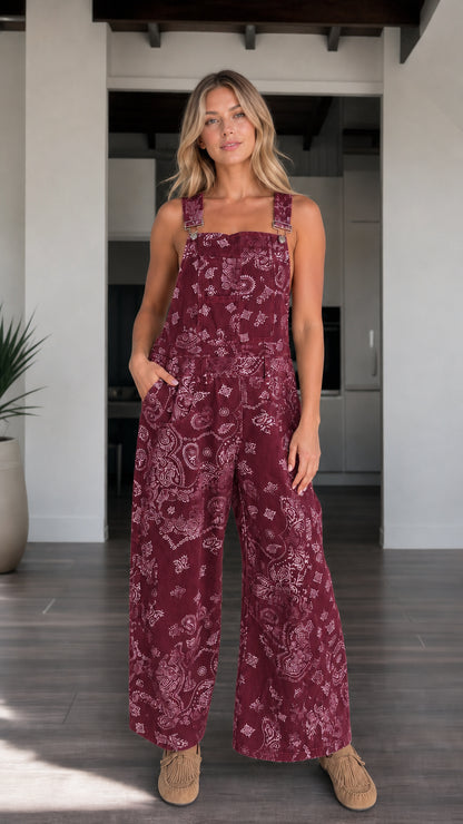 Front view of woman wearing Burgundy paisley print wide-leg overalls