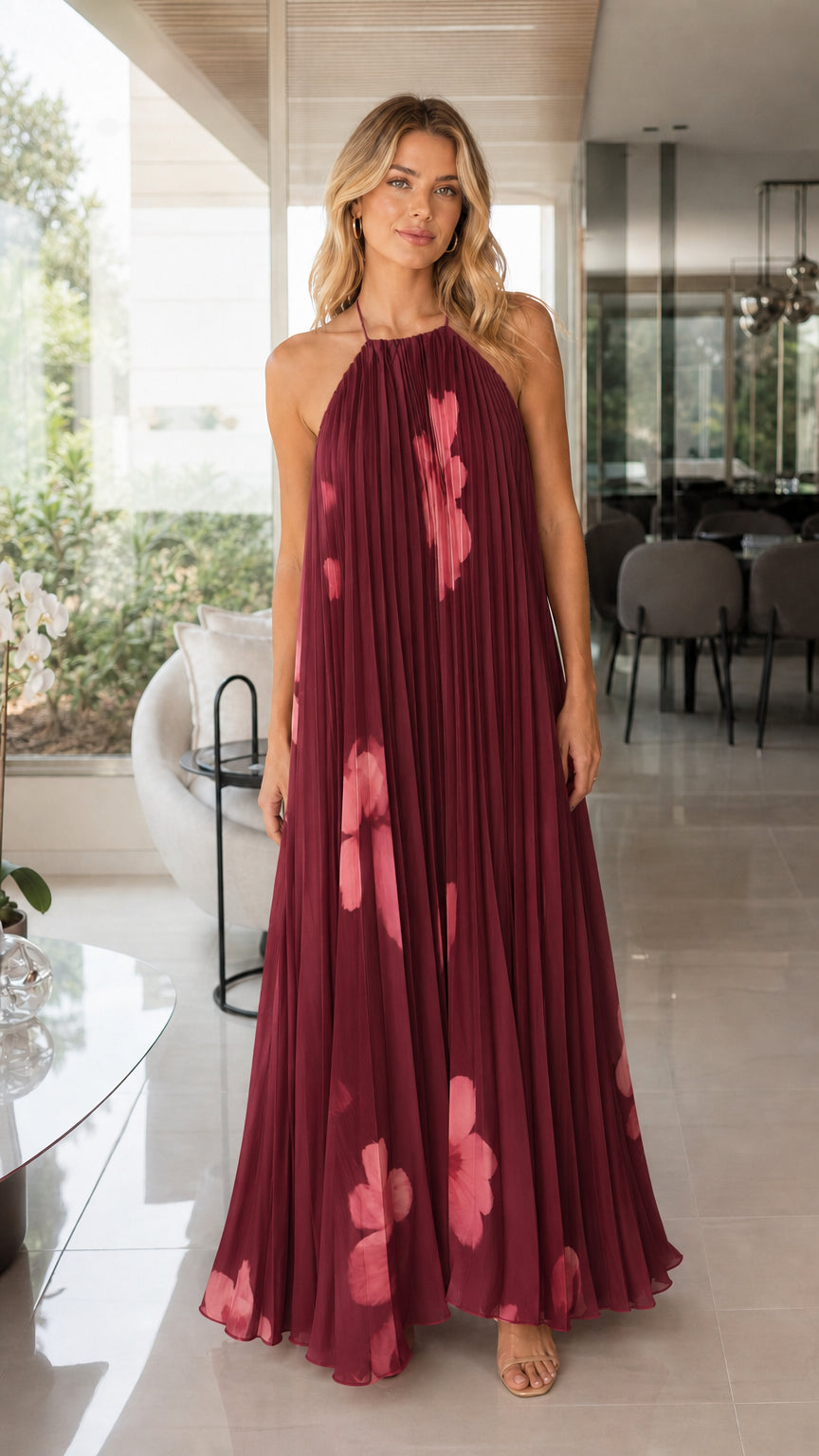 Woman wearing burgundy floral pleated maxi dress