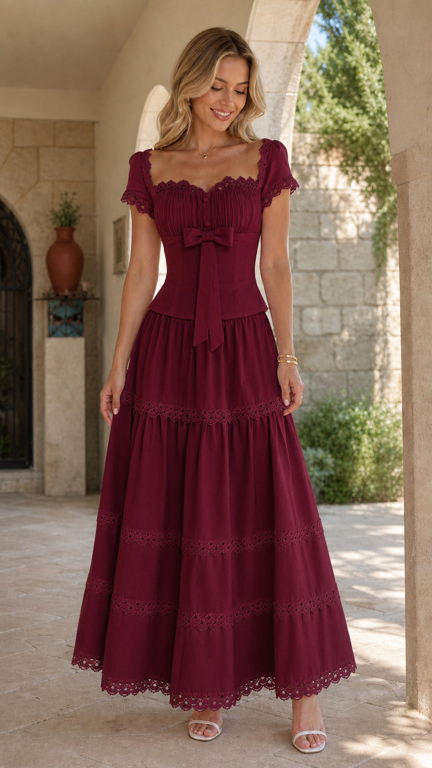 Model wearing rich burgundy wine tiered maxi dress with scalloped lace details