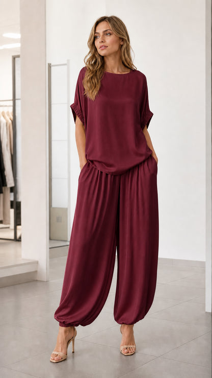 Front view of model wearing burgundy two-piece lounge set