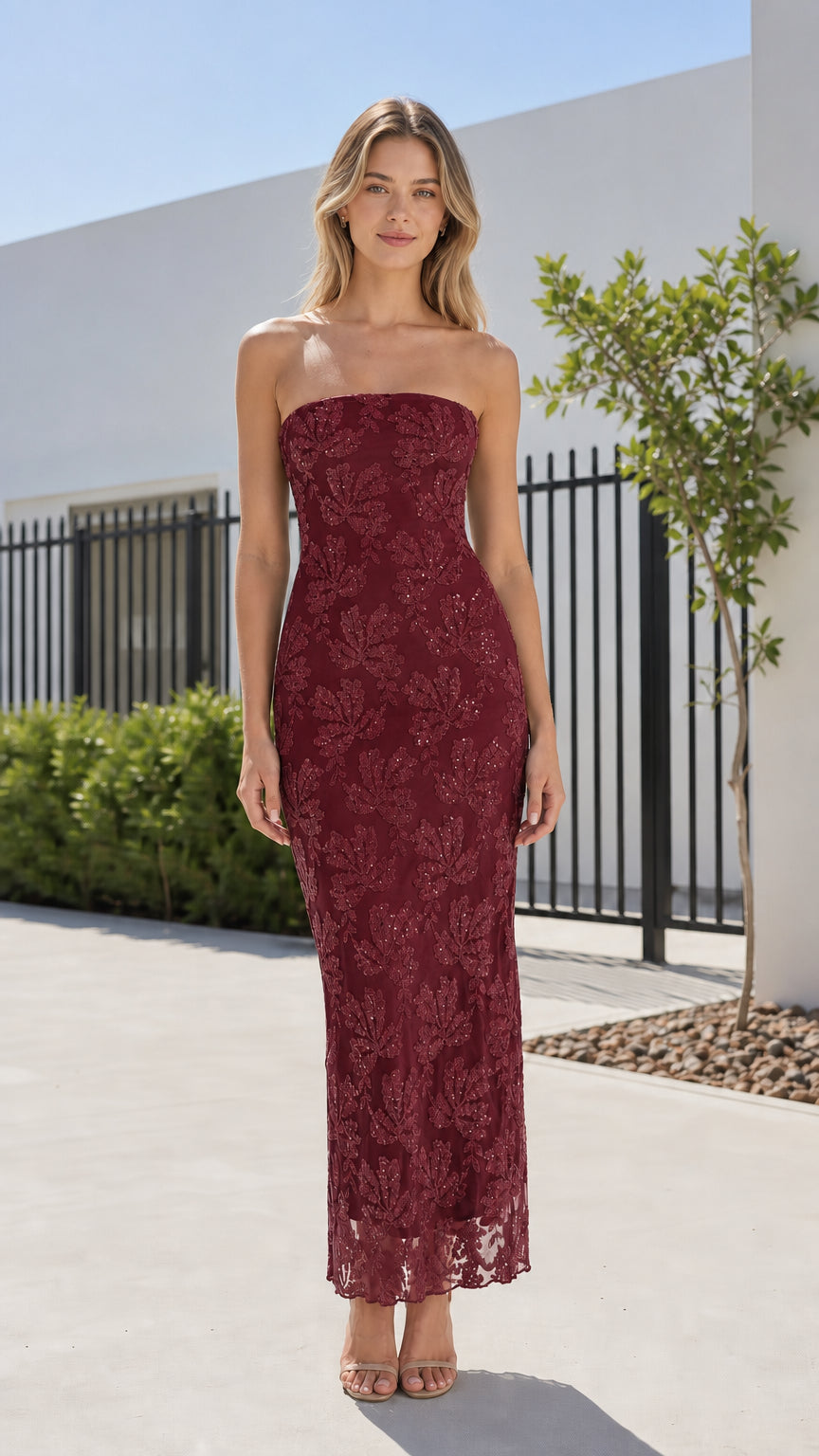 Front view of model wearing burgundy strapless sequin lace maxi dress
