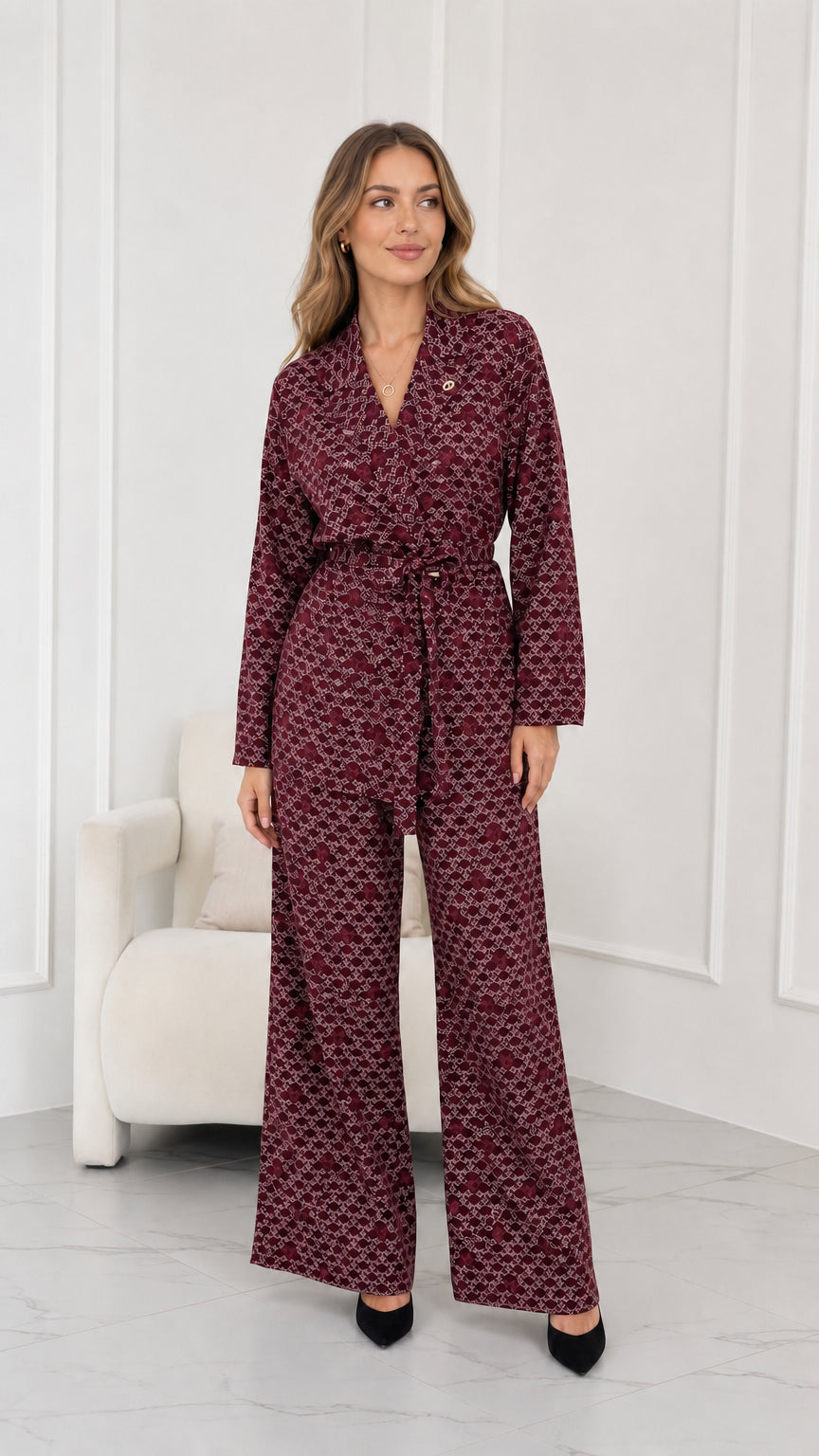 Model wearing burgundy wine geometric print belted pant suit