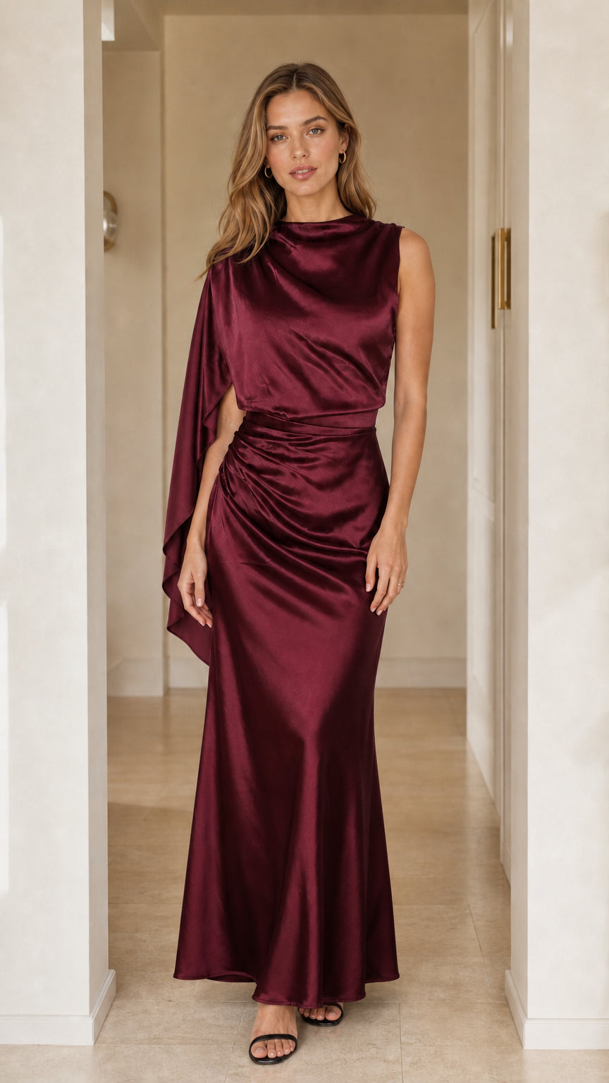 Front view of burgundy red asymmetric cape sleeve satin gown
