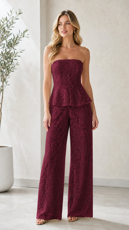 Model wearing burgundy red strapless lace peplum wide leg jumpsuit