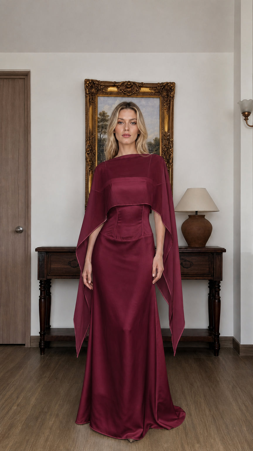 Front view of woman wearing burgundy cape overlay evening dress