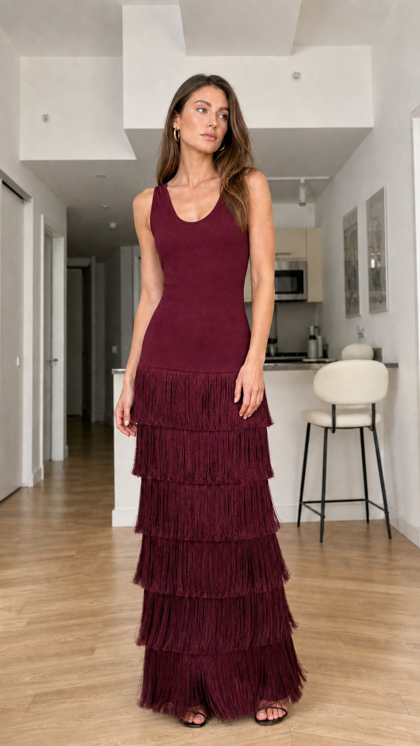 Full-length front view of burgundy sleeveless tiered fringe maxi dress