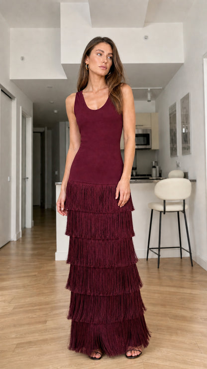 Full-length front view of burgundy sleeveless tiered fringe maxi dress